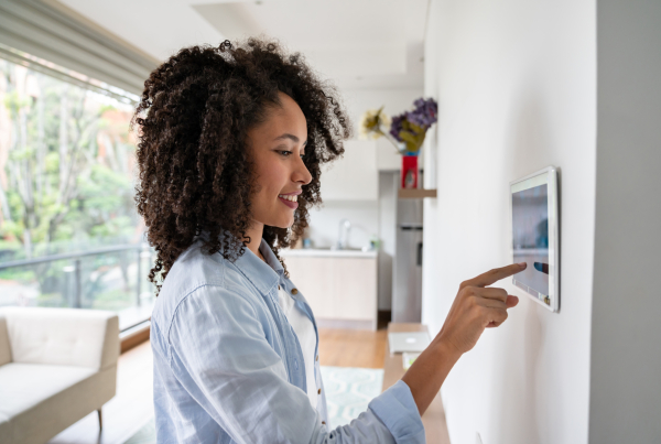Woman Using A Wall Tablet