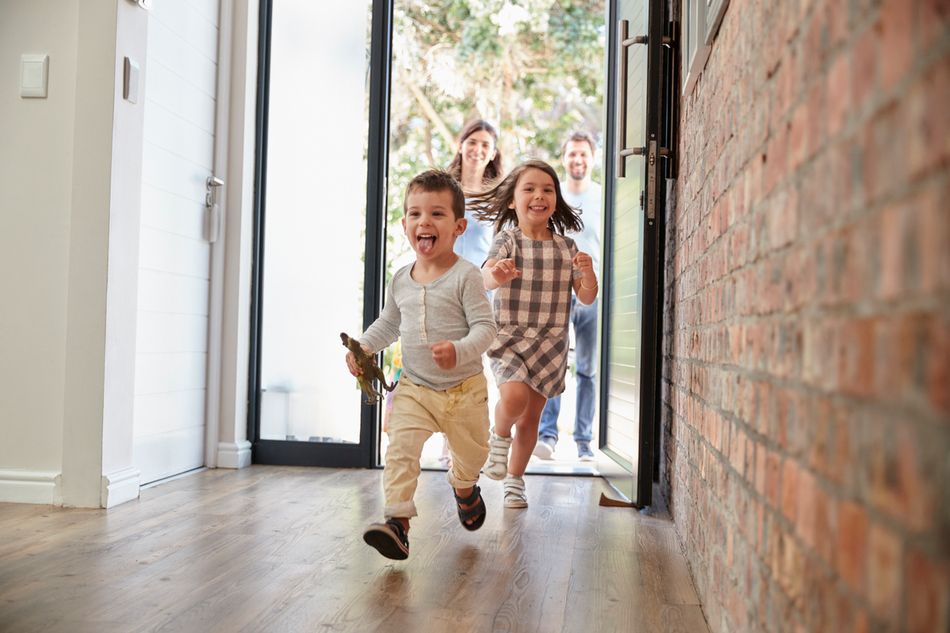 Happy family returning to a safe home