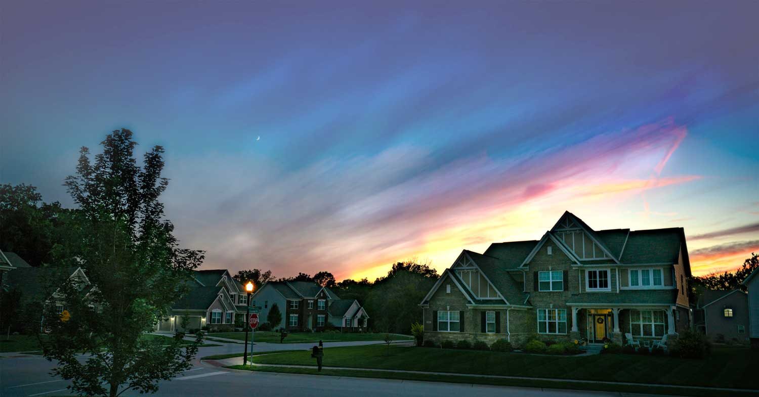 Residential home at dusk secured with Guardian Alarm home automation