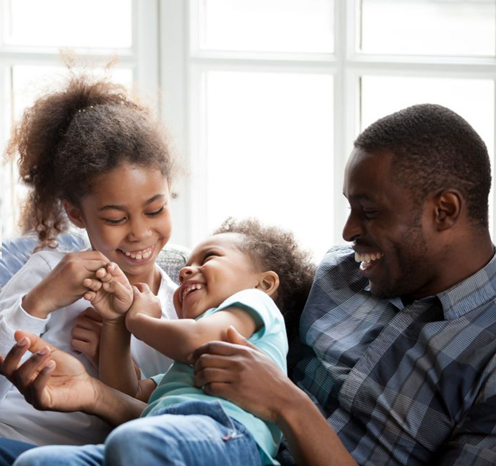 Family laughing together at home